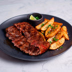 Arrachera al grill y papas gajo